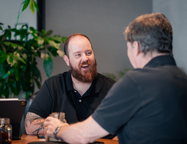 Two men speaking to each other