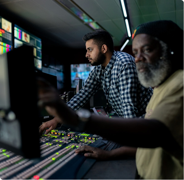 Two men looking at monitors